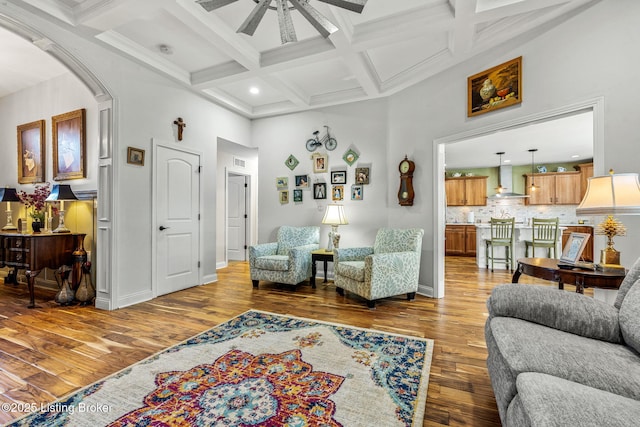 17900 Meremont Heights Way, Louisville, KY 40245 - living room with a towering ceiling, a ceiling fan, coffered ceiling, arched walkways, and wood finished floors
