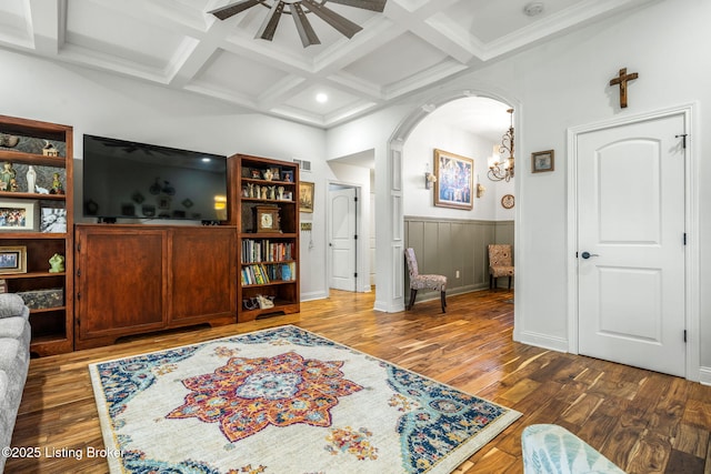 17900 Meremont Heights Way, Louisville, KY 40245 - living area with beamed ceiling, wood finished floors, coffered ceiling, a chandelier, and arched walkways