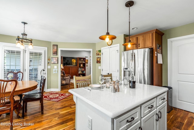 17900 Meremont Heights Way, Louisville, KY 40245 - kitchen featuring stainless steel fridge, dark wood-style floors, hanging light fixtures, a kitchen island, and baseboards