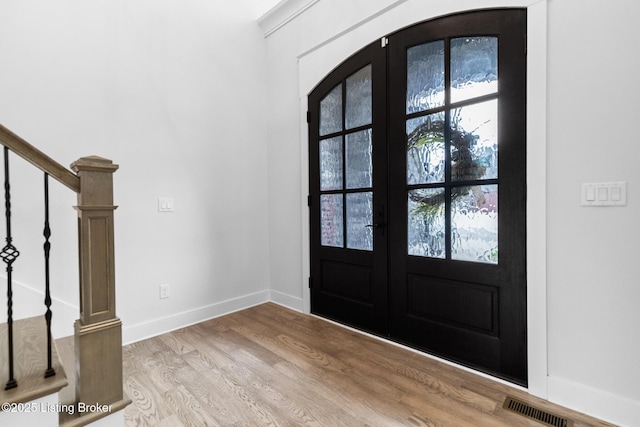 118 Stable Way, Jeffersonville, IN 47130 - entrance foyer with light wood finished floors, baseboards, stairs, and french doors