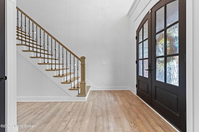 118 Stable Way, Jeffersonville, IN 47130 - foyer featuring french doors, wood finished floors, baseboards, and stairway