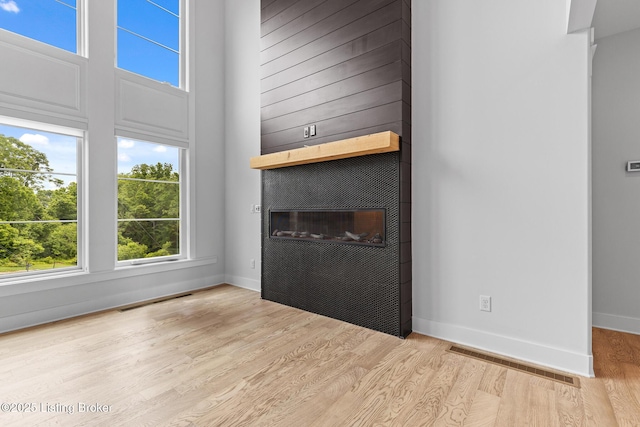 118 Stable Way, Jeffersonville, IN 47130 - unfurnished living room featuring a fireplace, wood finished floors, and baseboards