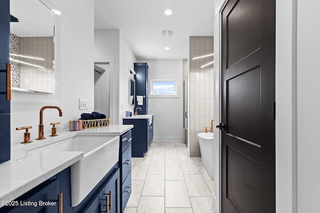 118 Stable Way, Jeffersonville, IN 47130 - bathroom featuring two vanities, a soaking tub, a stall shower, recessed lighting, and marble look tile flooring