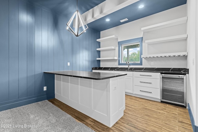 118 Stable Way, Jeffersonville, IN 47130 - kitchen with open shelves, beverage cooler, dark countertops, a sink, and white cabinetry