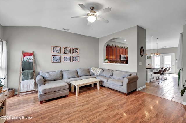 11601 Top Walnut Loop, Louisville, KY 40229 - living area with a ceiling fan, vaulted ceiling, light wood finished floors, and baseboards