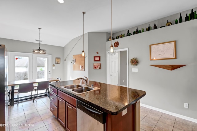 11601 Top Walnut Loop, Louisville, KY 40229 - kitchen featuring stainless steel appliances, a sink, light tile patterned floors, dark countertops, and decorative light fixtures