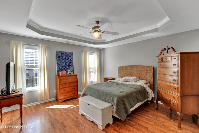 11601 Top Walnut Loop, Louisville, KY 40229 - bedroom with a tray ceiling, light wood-style flooring, crown molding, and a ceiling fan