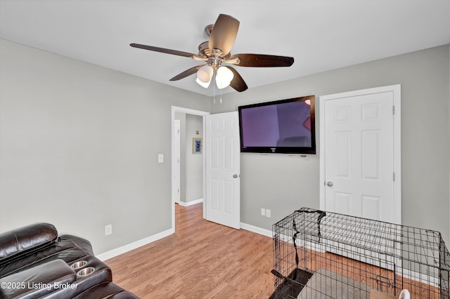 11601 Top Walnut Loop, Louisville, KY 40229 - living area featuring a ceiling fan, light wood-type flooring, and baseboards