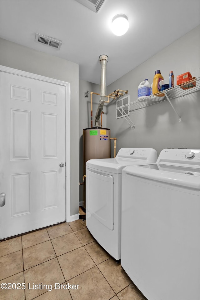 11601 Top Walnut Loop, Louisville, KY 40229 - washroom with washing machine and dryer, light tile patterned floors, and baseboards