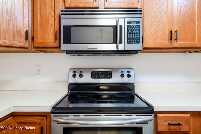 4225 Treesdale Dr, Sellersburg, IN 47172 - kitchen featuring appliances with stainless steel finishes, light countertops, and brown cabinets