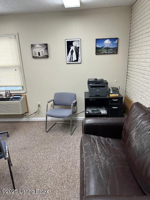 4012 Dupont Cir Unit 214, Louisville, KY 40207 - living area featuring carpet floors and baseboards