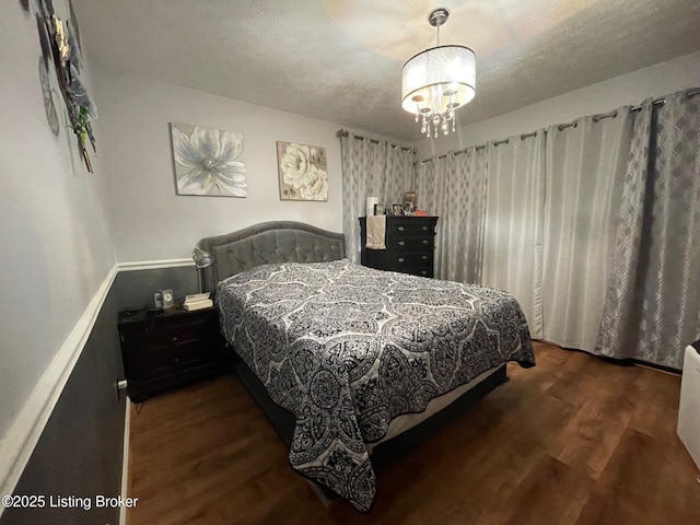 7102 Gorham Way, Louisville, KY 40291 - bedroom with wood finished floors, a textured ceiling, and a chandelier