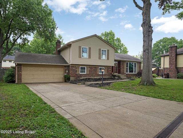 8703 Bards Ct, Louisville, KY 40299 - split level home with brick siding, an attached garage, concrete driveway, a front yard, and a chimney