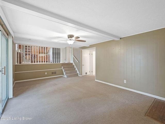 8703 Bards Ct, Louisville, KY 40299 - unfurnished room with carpet flooring, a ceiling fan, stairway, beamed ceiling, and baseboards