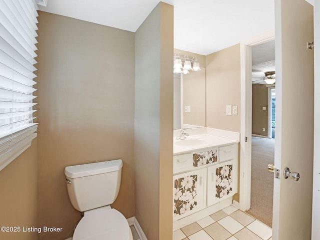 8703 Bards Ct, Louisville, KY 40299 - half bathroom with vanity, toilet, and a ceiling fan