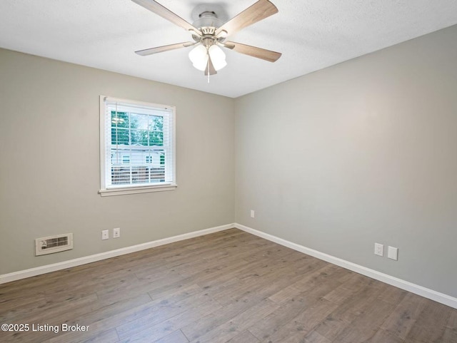 8703 Bards Ct, Louisville, KY 40299 - empty room with wood finished floors, baseboards, and a ceiling fan