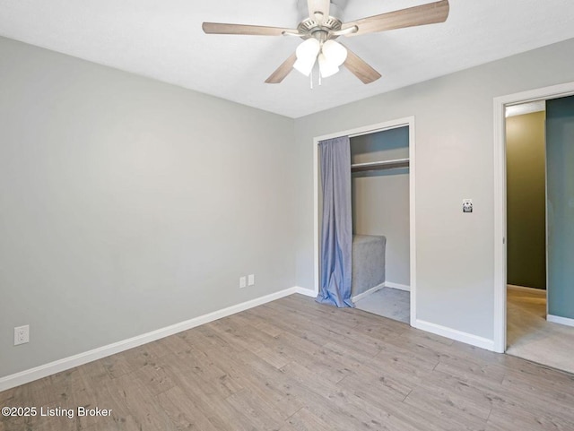 8703 Bards Ct, Louisville, KY 40299 - unfurnished bedroom featuring wood finished floors, a closet, baseboards, and a ceiling fan