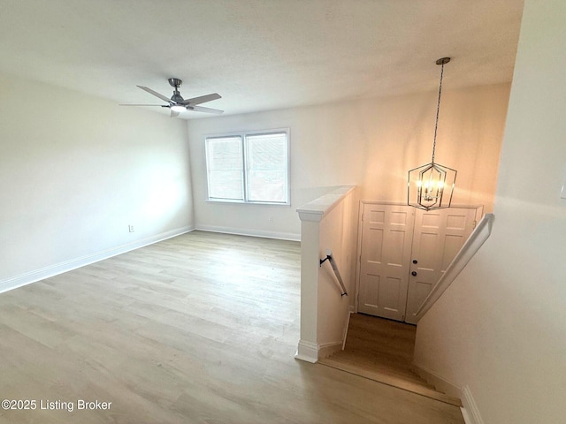 11302 Deering Rd, Louisville, KY 40272 - stairway with wood finished floors, a chandelier, and a ceiling fan