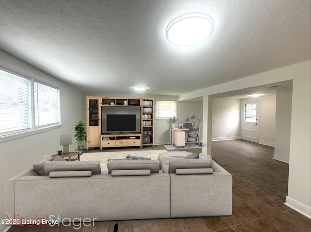 11302 Deering Rd, Louisville, KY 40272 - living area with a textured ceiling and dark tile patterned flooring