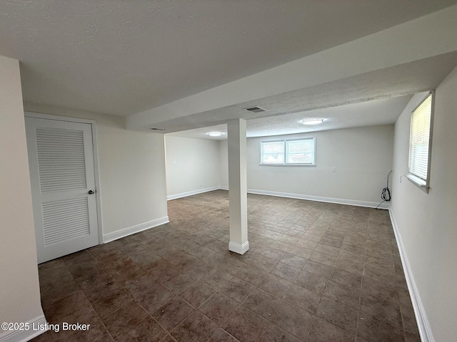 11302 Deering Rd, Louisville, KY 40272 - below grade area featuring baseboards and a textured ceiling
