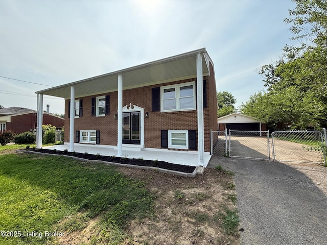 11302 Deering Rd, Louisville, KY 40272 - split foyer home with a gate, a garage, and brick siding