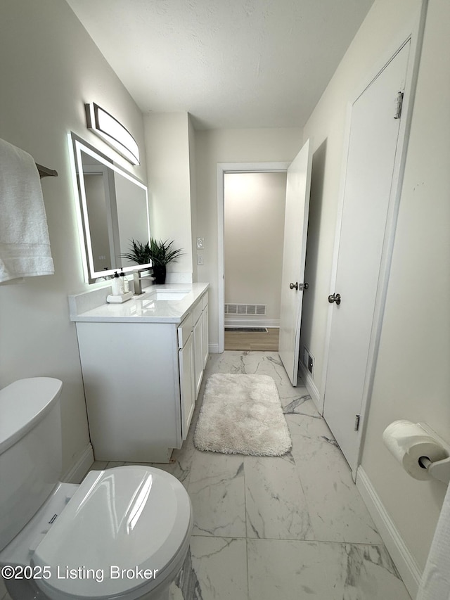 11302 Deering Rd, Louisville, KY 40272 - bathroom with marble look tile flooring and vanity