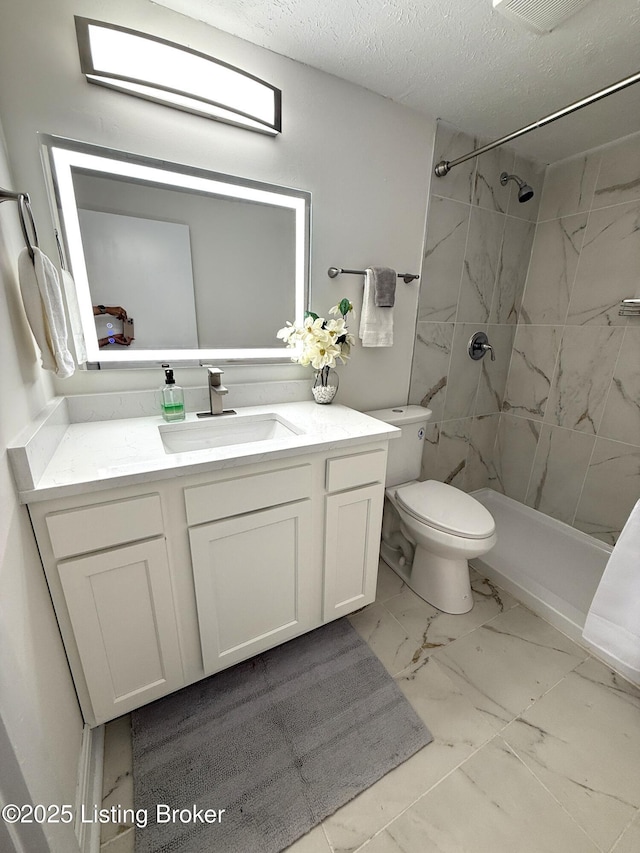 11302 Deering Rd, Louisville, KY 40272 - bathroom featuring marble finish flooring, vanity, tiled shower, and a textured ceiling