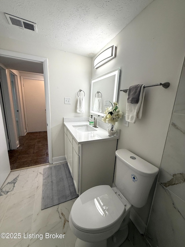 11302 Deering Rd, Louisville, KY 40272 - bathroom with vanity, a textured ceiling, and marble look tile flooring