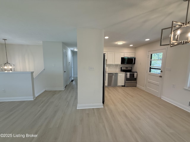 11302 Deering Rd, Louisville, KY 40272 - kitchen with stainless steel appliances, a chandelier, light wood-style floors, and recessed lighting