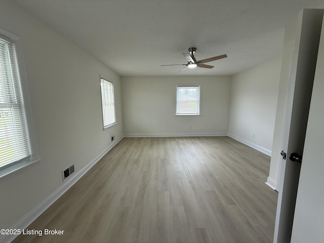 11302 Deering Rd, Louisville, KY 40272 - spare room featuring healthy amount of natural light, ceiling fan, and light wood-style floors