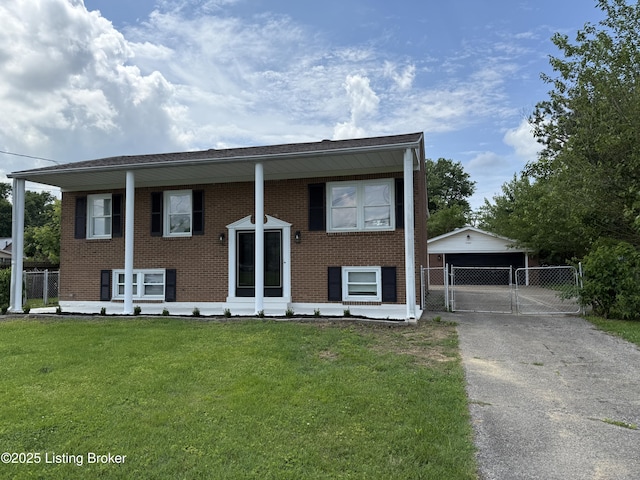 11302 Deering Rd, Louisville, KY 40272 - raised ranch featuring brick siding, a gate, an outbuilding, and a garage