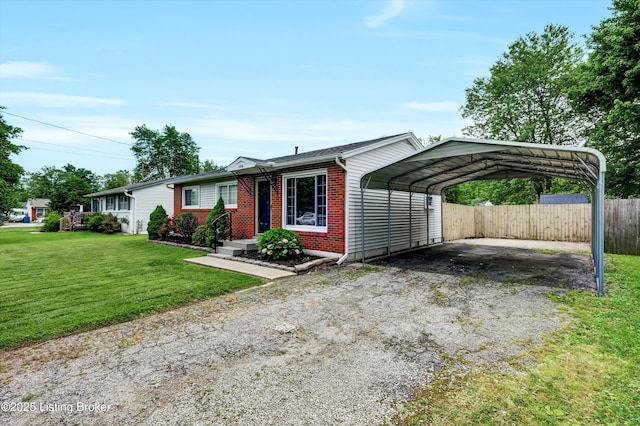 6106 Dobson Ct, Louisville, KY 40229 - view of front facade featuring asphalt driveway, brick siding, and a carport