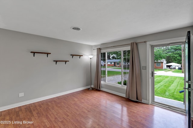 6106 Dobson Ct, Louisville, KY 40229 - unfurnished room with plenty of natural light, wood finished floors, and baseboards