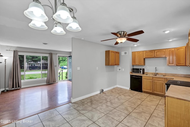 6106 Dobson Ct, Louisville, KY 40229 - kitchen with stainless steel microwave, dishwasher, a sink, light countertops, and ceiling fan