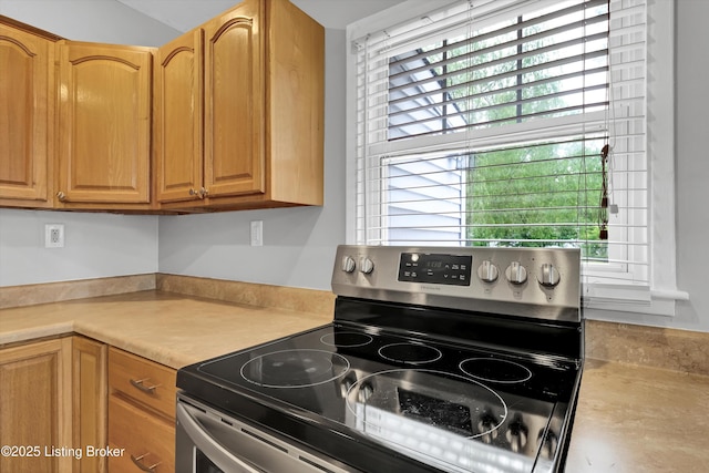 6106 Dobson Ct, Louisville, KY 40229 - kitchen featuring electric range and light countertops