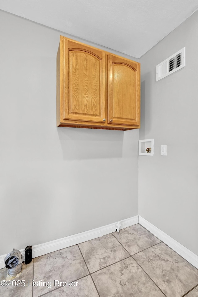6106 Dobson Ct, Louisville, KY 40229 - laundry room with washer hookup, cabinet space, and baseboards
