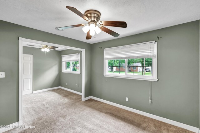 6106 Dobson Ct, Louisville, KY 40229 - carpeted empty room with a ceiling fan, baseboards, and a textured ceiling
