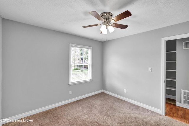 6106 Dobson Ct, Louisville, KY 40229 - carpeted spare room with a textured ceiling, baseboards, and a ceiling fan