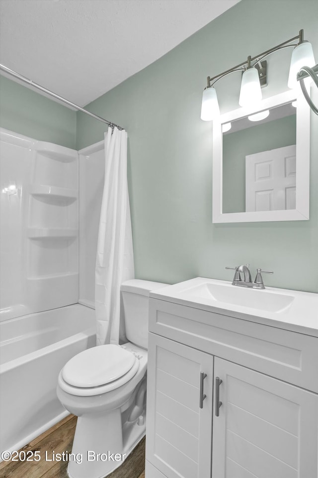 6106 Dobson Ct, Louisville, KY 40229 - bathroom with vanity, shower / tub combo, toilet, and wood finished floors