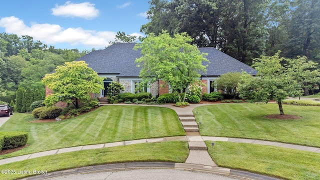 527 Woodlake Dr, Louisville, KY 40245 - view of front of home with a front lawn, roof with shingles, and brick siding