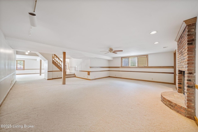 527 Woodlake Dr, Louisville, KY 40245 - basement featuring light colored carpet, a ceiling fan, stairs, healthy amount of natural light, and recessed lighting