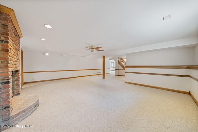 527 Woodlake Dr, Louisville, KY 40245 - finished below grade area with stairs, carpet, a fireplace, recessed lighting, and ceiling fan