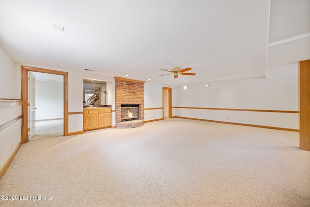 527 Woodlake Dr, Louisville, KY 40245 - unfurnished living room featuring light carpet, a ceiling fan, and a brick fireplace