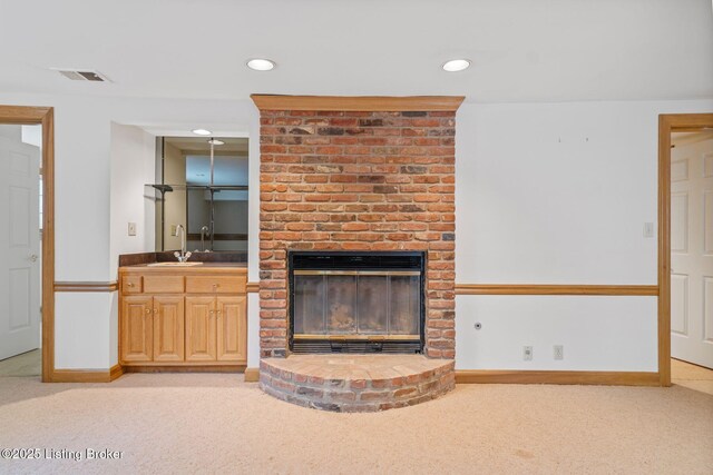 527 Woodlake Dr, Louisville, KY 40245 - unfurnished living room with light colored carpet, recessed lighting, and a fireplace