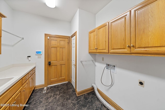 527 Woodlake Dr, Louisville, KY 40245 - laundry area with hookup for an electric dryer, cabinet space, and dark marble finish floors