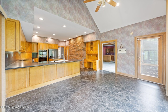 527 Woodlake Dr, Louisville, KY 40245 - kitchen with high vaulted ceiling, stainless steel fridge with ice dispenser, a ceiling fan, a peninsula, and dark countertops