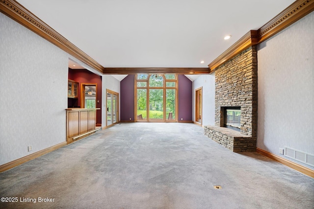 527 Woodlake Dr, Louisville, KY 40245 - unfurnished living room with ornamental molding, carpet floors, a stone fireplace, recessed lighting, and vaulted ceiling