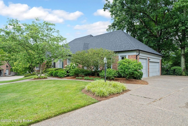 527 Woodlake Dr, Louisville, KY 40245 - view of front facade with brick siding, roof with shingles, a front lawn, an attached garage, and concrete driveway