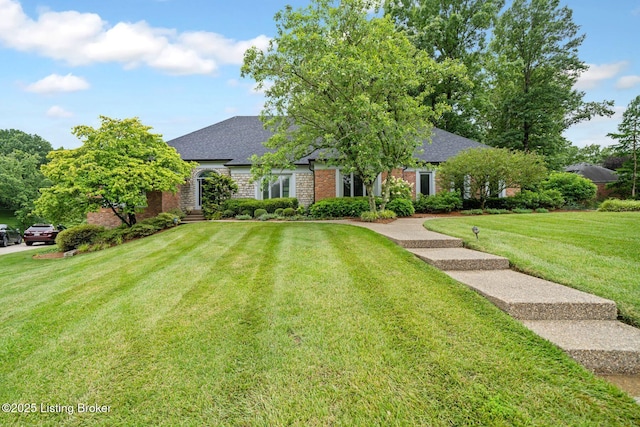 527 Woodlake Dr, Louisville, KY 40245 - view of front of property featuring brick siding, a front yard, and a shingled roof