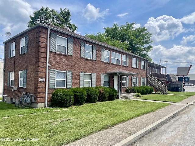 4143 Hillview Ave, Louisville, KY 40216 - view of property with a front lawn, brick siding, and cooling unit